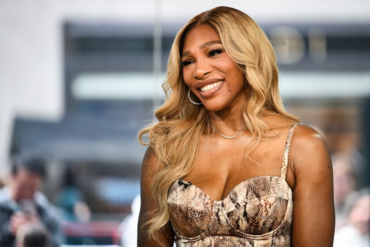 Serena Williams smiles while seated